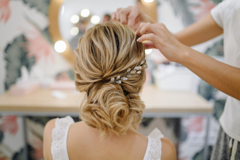 hairdresser woman weaving braid hair wedding styling